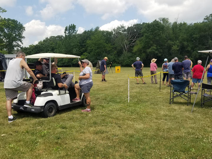 A huddle at the "conference" cart.