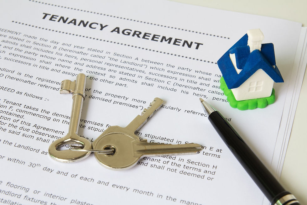 house keys and a pen placed over a tenancy agreement paperwork