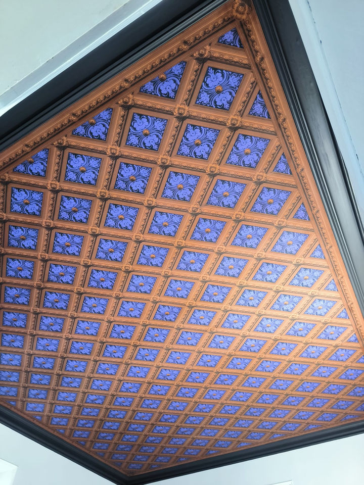 Dramatic geometric Zuber wallpaper installed on the ceiling by Fouassier