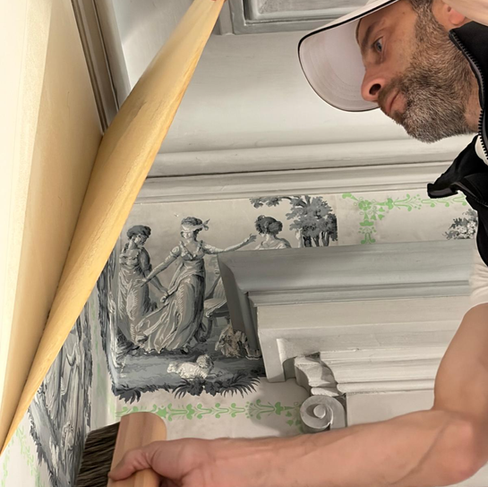 Fouassier smoothing the Mauny wallpaper