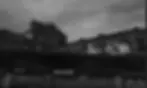An abandoned industrial plant. A black-and-white photo.
