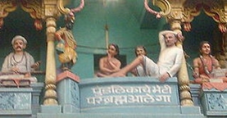 Statues at temple with text "पुंडलिकचे भेटी, परब्रह्म आले गा" Guru Purnima 2025 celebration. PANDITJIPUNE