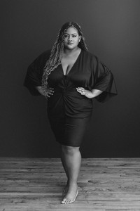 Nicole standing in black dress