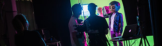 People At A film Studio With Green Screen