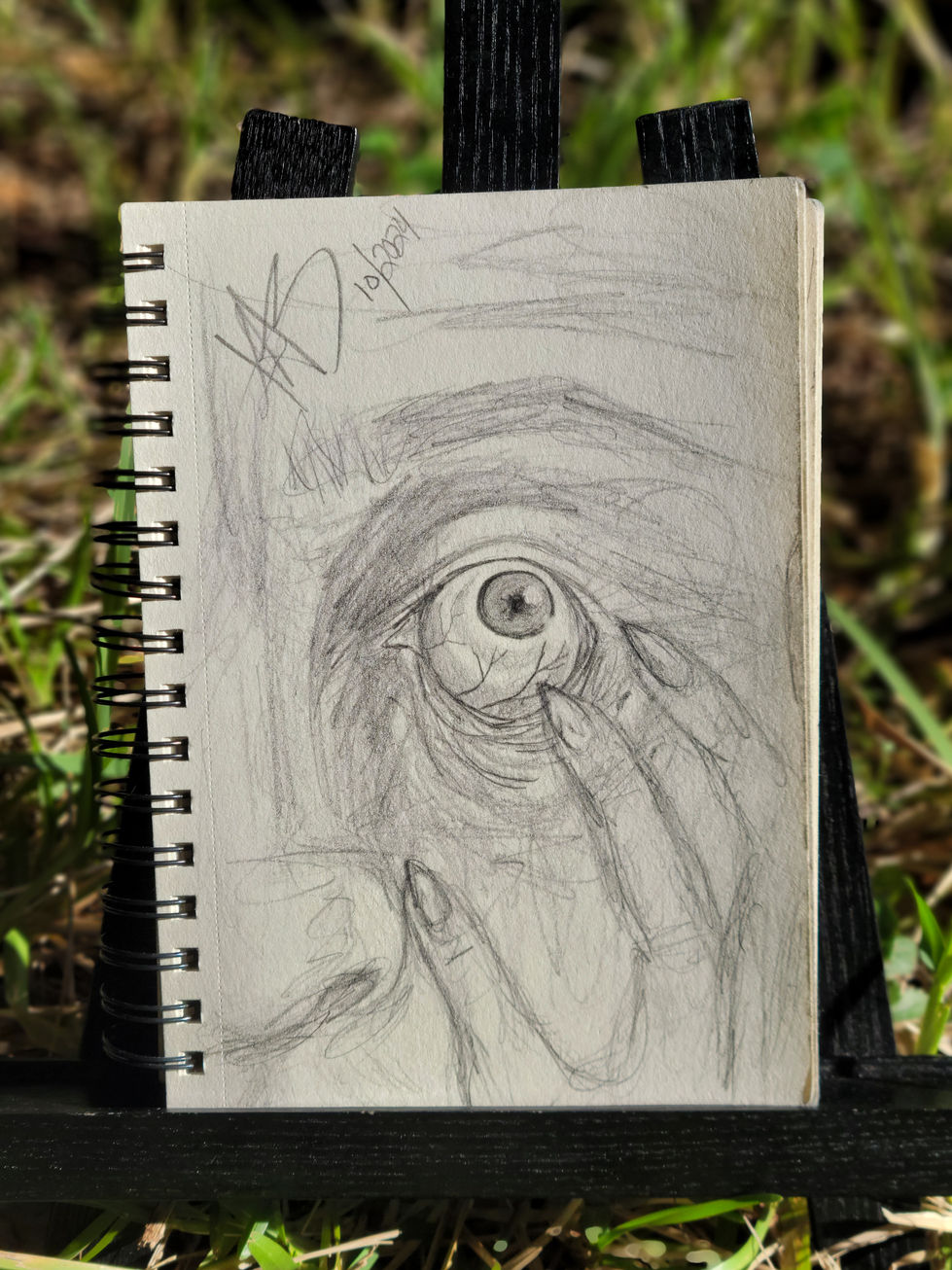 drawing of the left side of someone's face as they rub something in their eye out