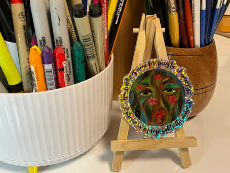 Glitter sticker with image of a Spirit of the Forest and the words “A Dream is a Proposal to the Universe”