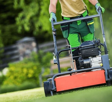 Lawn aerator machine working on grass.JPG