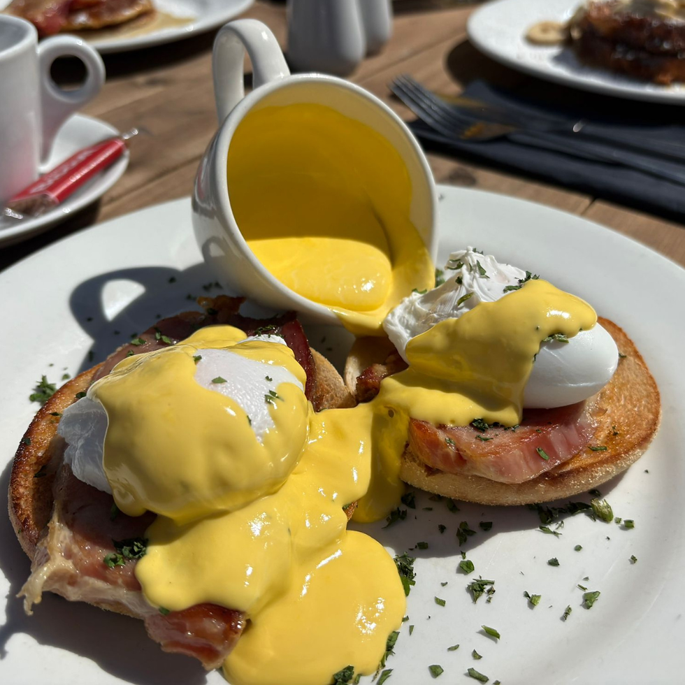 Close-up view of a brunch plate with eggs, avocado, and toast at Ten Tors Inn