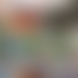 someone is pouring some rose wine into a glass