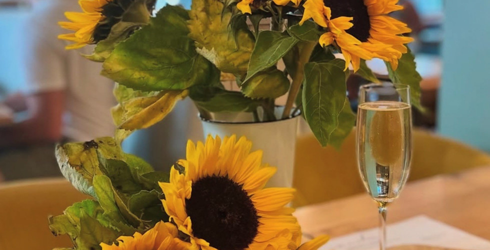 sunflower bouquet with a flammekueche at Amelie Restaurant