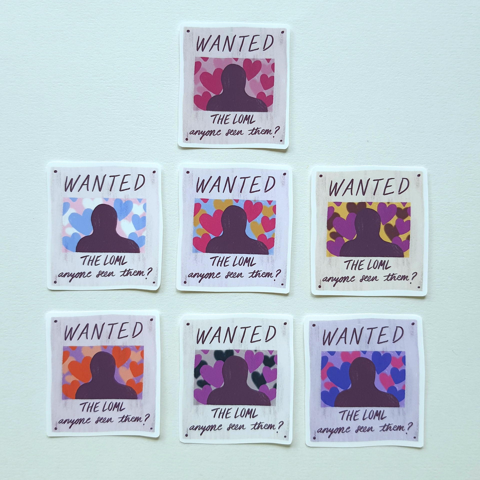 'Wanted' stickers in LGBTQ+ colours