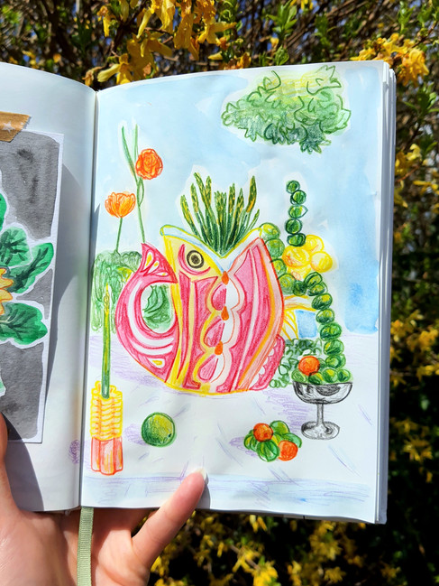 watercolour painting in a sketchbook of a fish vase and vegetables