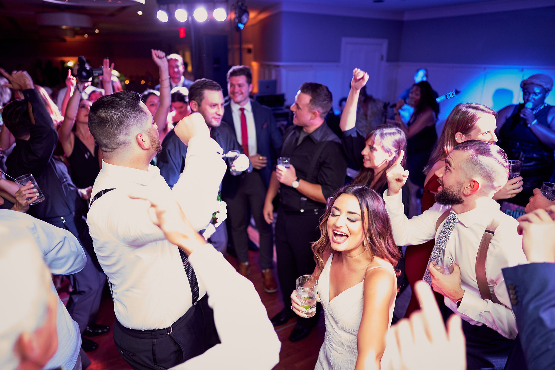 Wedding dancing and singing on the dance floor in Winnetka