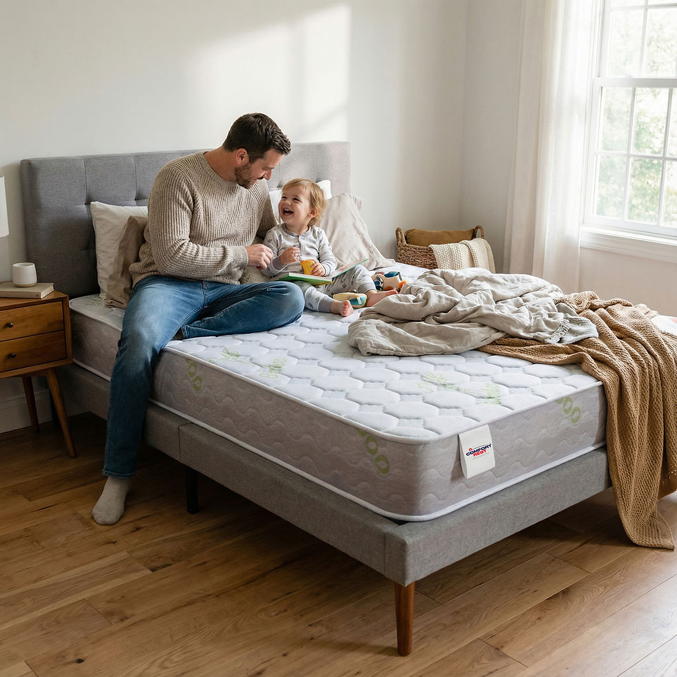 Father and child on bed, looking at each other, in a bright bedroom.