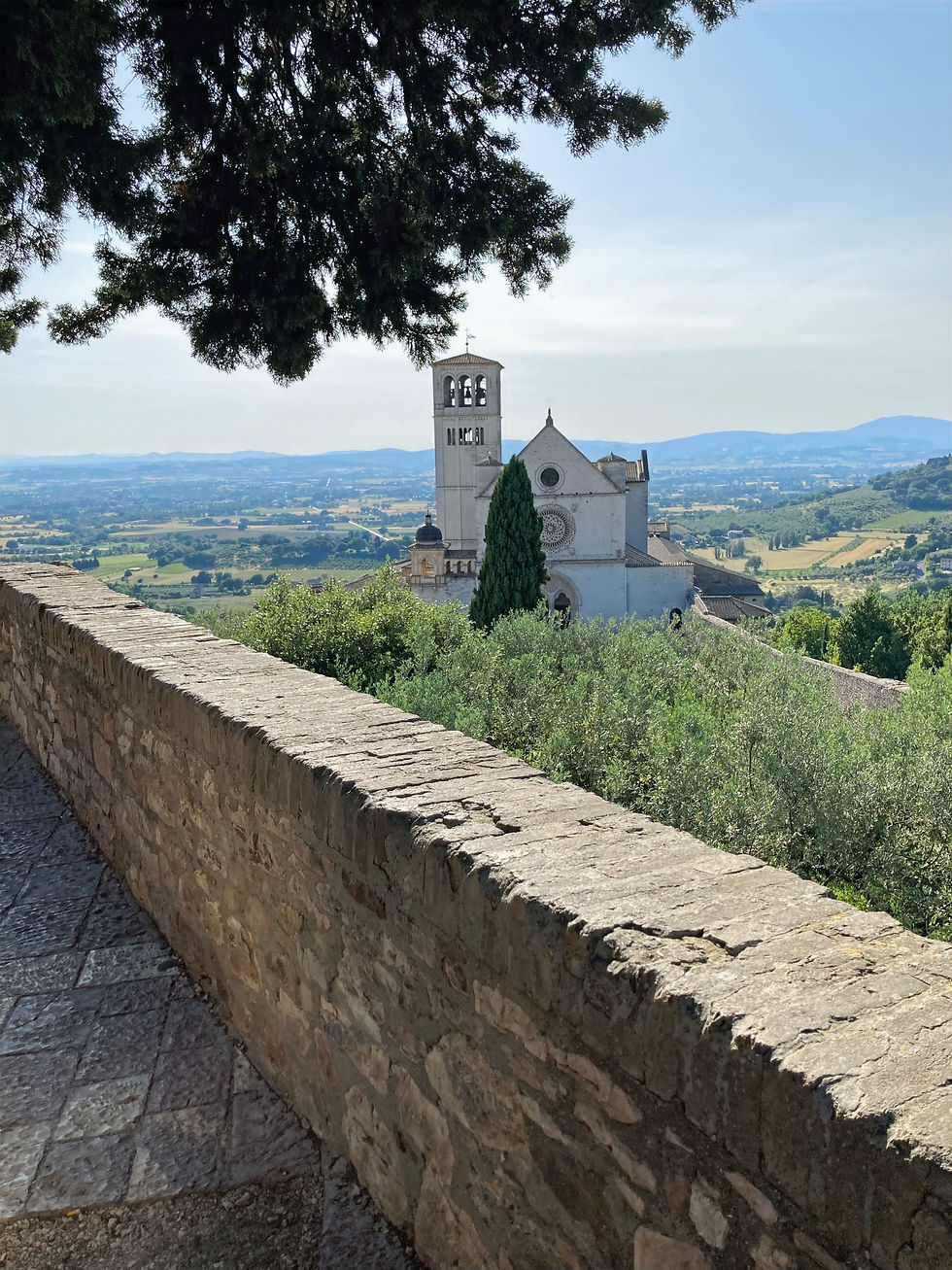 stone wall looking out of Assisi with Holly Bellebuono