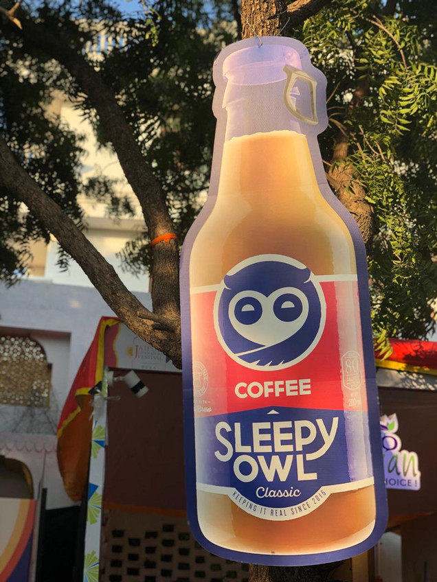 Giant Coffee Bottle Cutout for Sleepy Owl Coffee