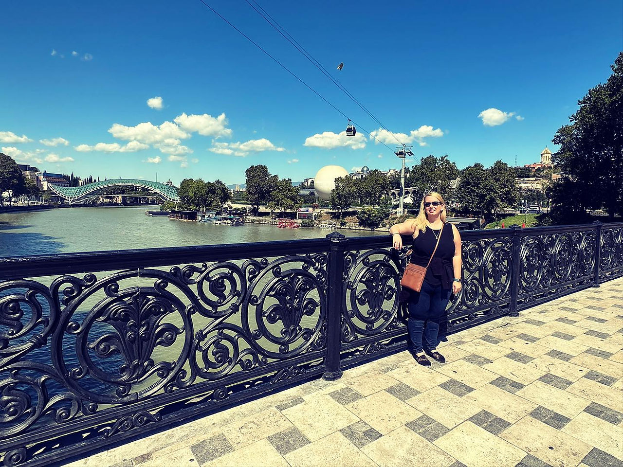 Me standing by river & bridge.