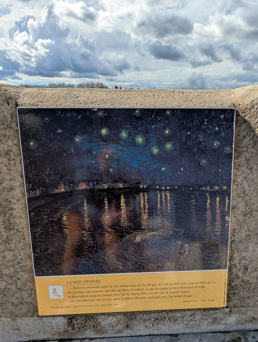 Easel mounted on a concrete wall depicting Van Gogh's "La Nuit Etoilee."