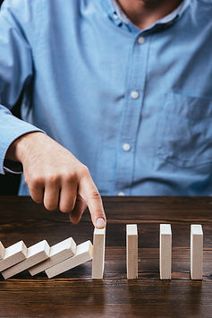 cropped-view-of-man-preventing-wooden-blocks-from-2026-01-05-23-56-29-utc.jpg
