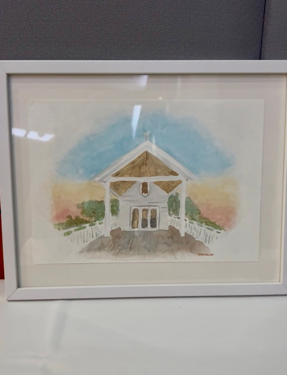 Stylised painting of a chapel at sunset.