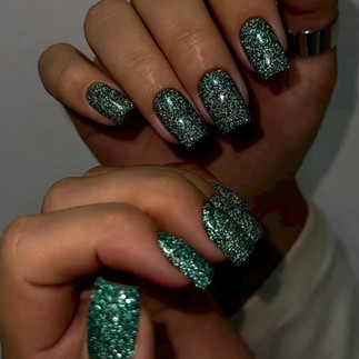 Bold and festive green glitter nails with a shimmering finish, ideal for making a statement this holiday season.
