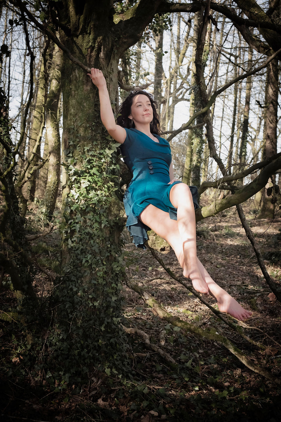 Storytelling photoshoot, spiritual healer, Katie Rose sitting in a tree