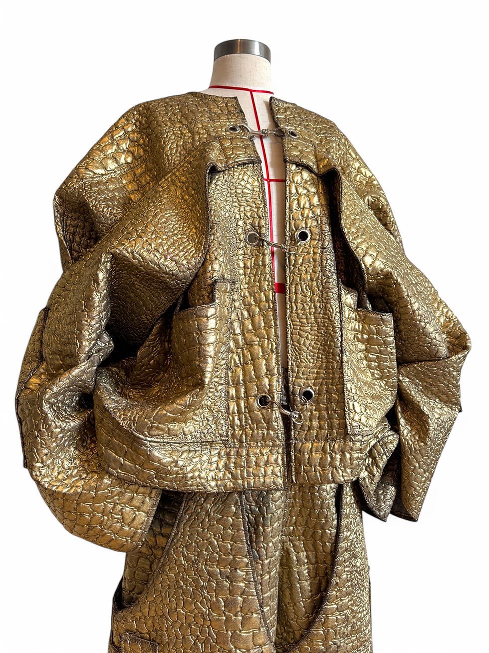 Sculptural London couture bomber with structured silhouette.