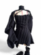 Avant-garde London couture dress with layered padded structure.