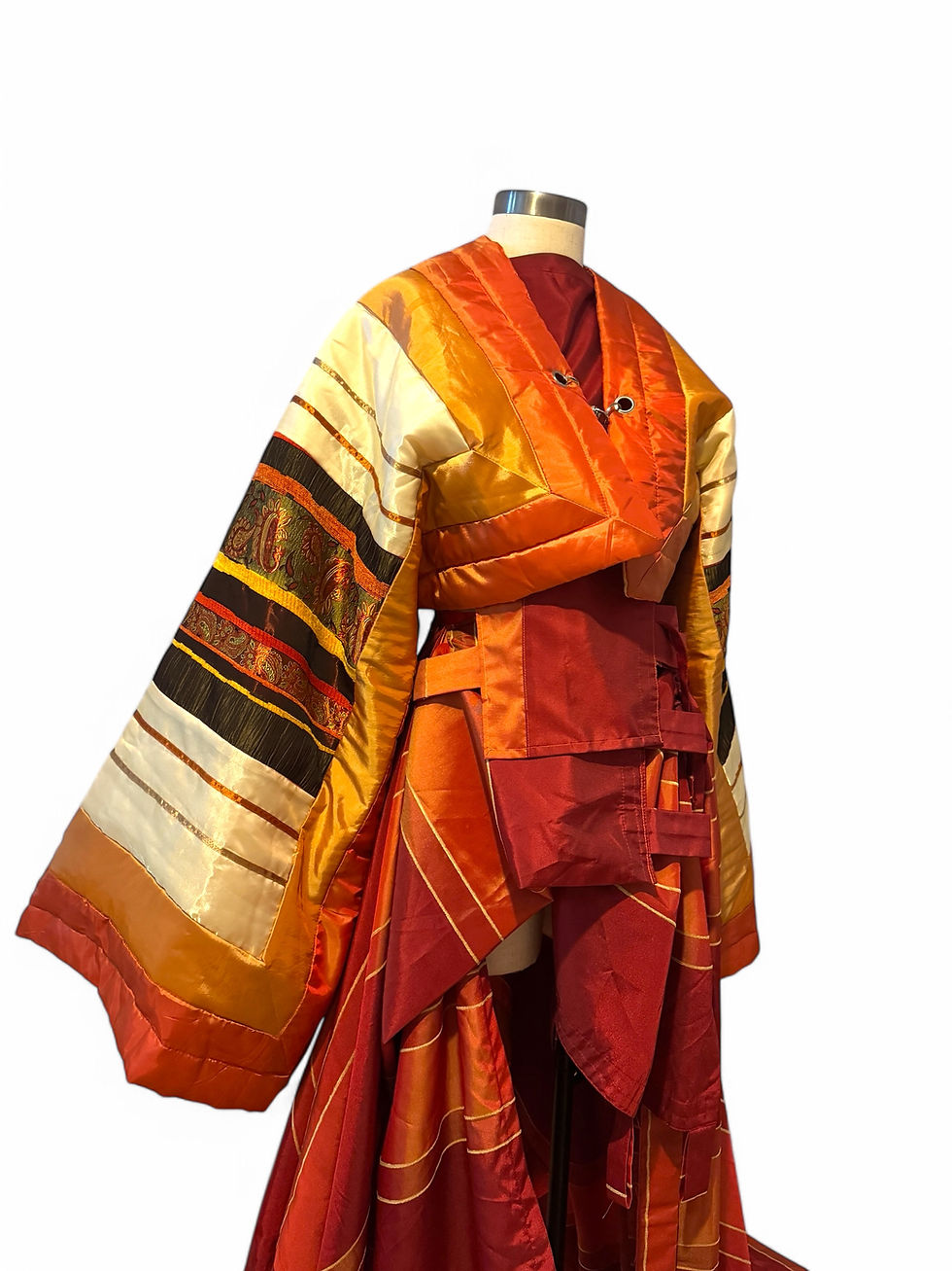 Avant-garde London couture Kimono with structured bodice and elongated train.