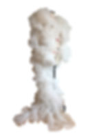 White sculptural couture dress displayed in studio.