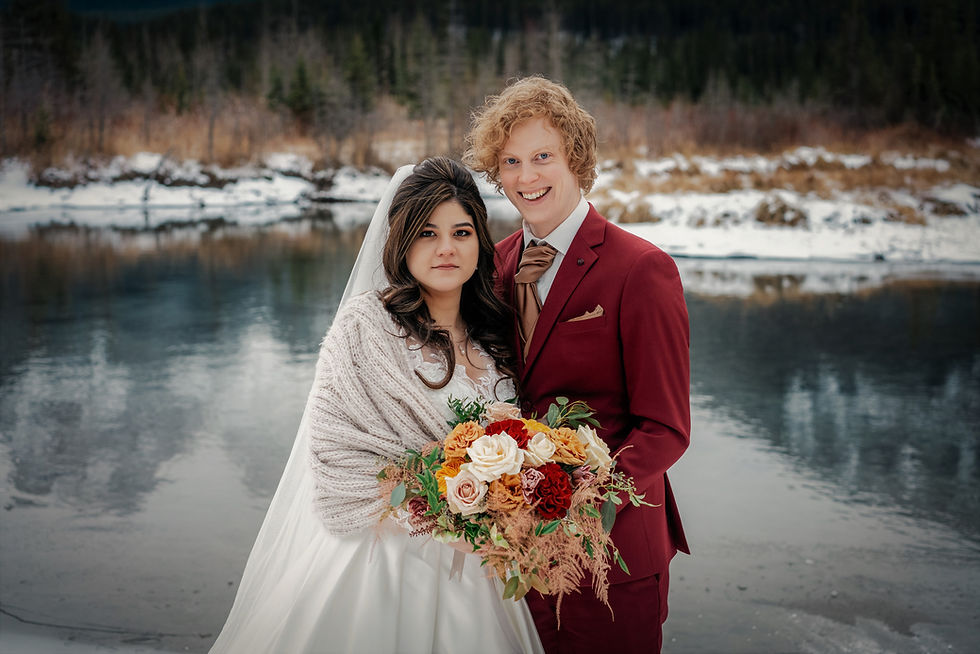 Beautiful Bride with a Happy Groom holding a fabulous Bridal Bouquet