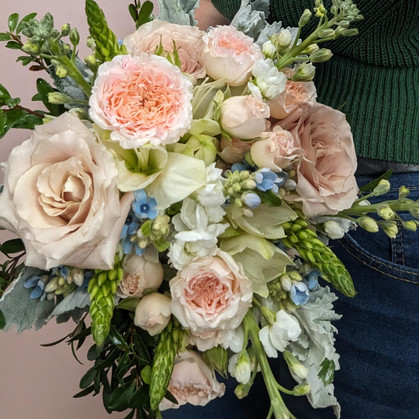soft and romantic peaches n' cream bouquet with a hint of pale blue