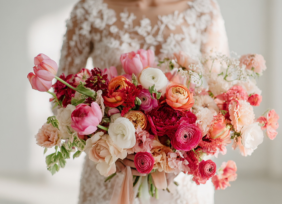 bride-holding-colorfu-bouquet.png