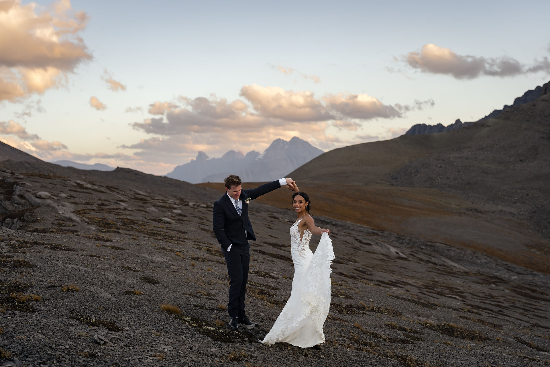 Golden hour elopement dance with breathtaking Banff mountain views