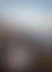 Banff helicopter elopement couple sharing a romantic kiss at sunset with sweeping mountain vistas