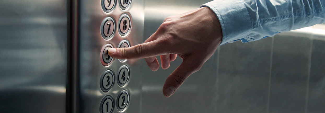 Pressing elevator button — contact us for service and support