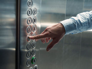 someone pressing the elevator button