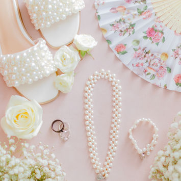 Bride wedding details flatlay pink and white.
