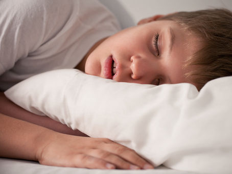 A boy sleeping with his mouth open