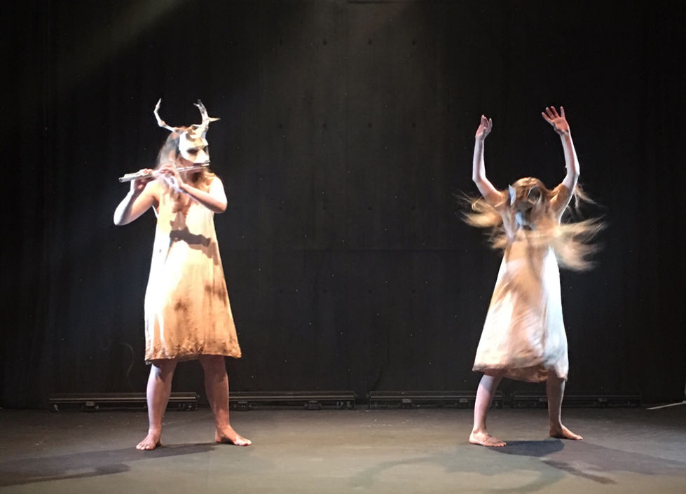 a flutist and a dancer mid erratic movement both wearing minimalist white animal masks and dirty creme dresses