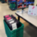 Reusable shipping bags in green box at fulfillment
