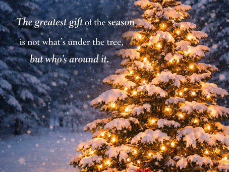 Christmas tree in snow with gifts and lights