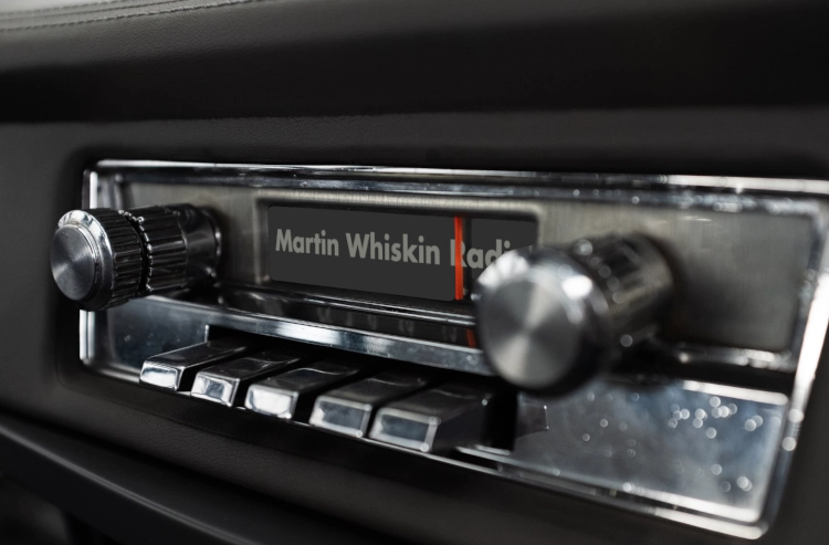An old car stereo playing Martin Whiskin radio