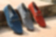 3 shoes propped against a step