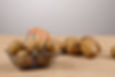 Potatoes fill a shopping basket