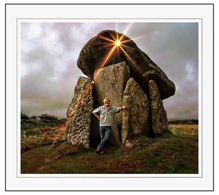 Pete Minall Writer in front of large stone formation