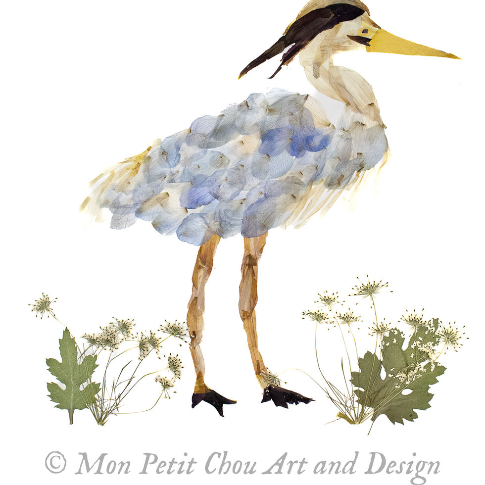 Pressed flower heron art titled Marshland Majesty showing a coastal heron created from real blue petals and greenery. Mon Pet