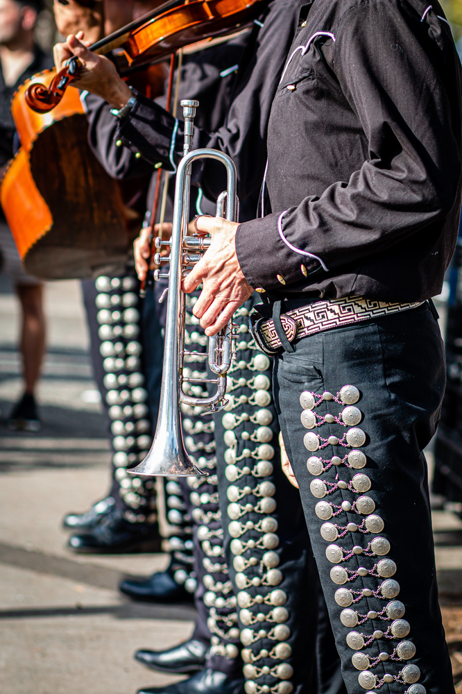 close up of mariachi instruments and costume