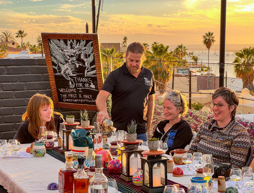 people sitting at table smiling