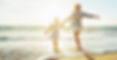 Mother and daughter having fun walking and playing on the beach at sunset.jpg